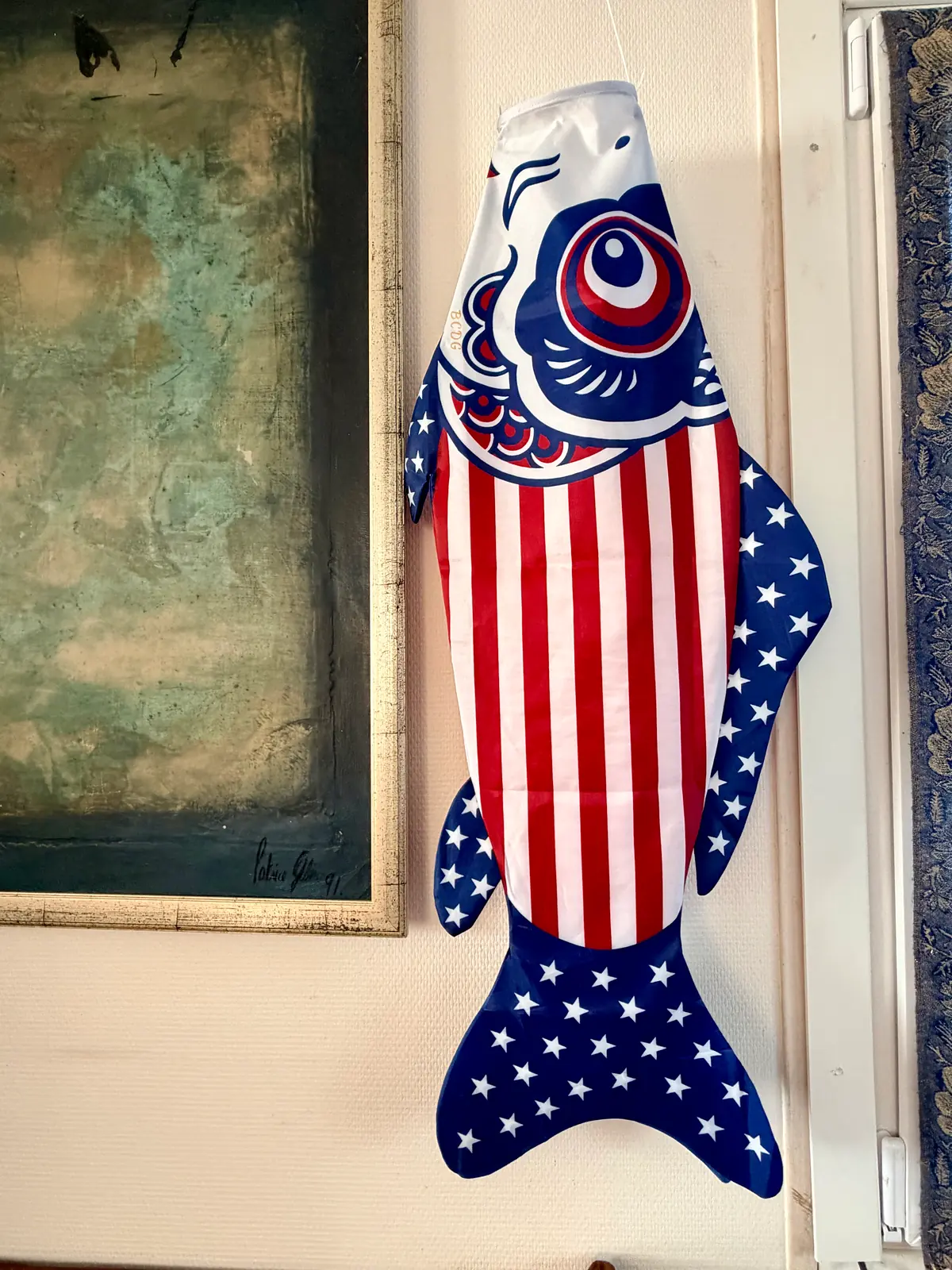 Stars & Stripes close up, in front of a painting